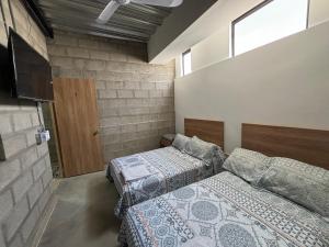 Postel nebo postele na pokoji v ubytování Hospedaje San Diego