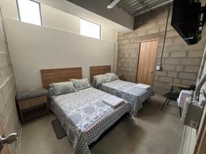 Postel nebo postele na pokoji v ubytování Hospedaje San Diego