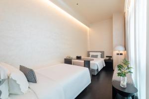 Voodi või voodid majutusasutuse LIKTO-YIYU Hotel Guangzhou Pazhou Exhibition Canton Tower Branch toas