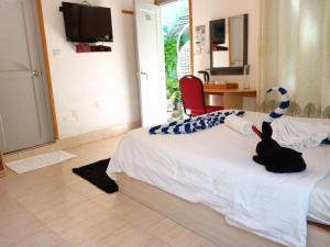 Letto o letti in una camera di Olhumathi View Inn
