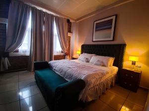 Postel nebo postele na pokoji v ubytování Hotel El Campanario