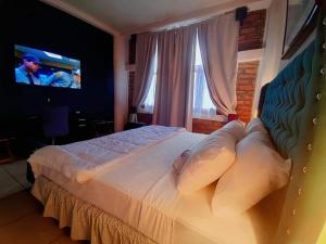 Postel nebo postele na pokoji v ubytování Hotel El Campanario