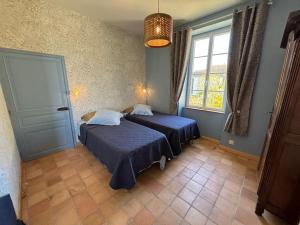 Ένα ή περισσότερα κρεβάτια σε δωμάτιο στο Le clos des Agapanthes Ile d'Oleron