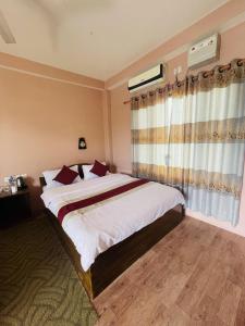 Ένα ή περισσότερα κρεβάτια σε δωμάτιο στο Tree Tops Retreat B&B