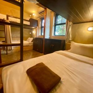 a bedroom with a large bed with a large mirror at 17Stories 2 in Pai