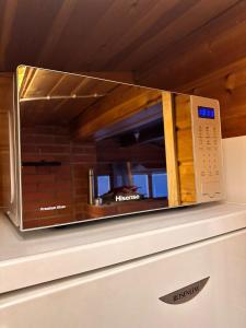 a microwave oven sitting on top of a counter at Experience amazing Ivalo 4,5km from the AirPort in Inari