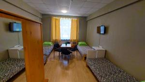 TV a/nebo společenská místnost v ubytování Happy Hostel