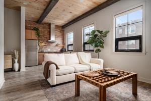 a living room with a white couch and a table at Pulaski Point Properties in Chicago
