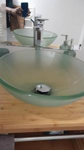 a sink with a faucet on top of a table at ALEIDA in La Rochelle +4 photos