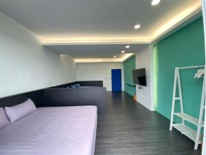 Postel nebo postele na pokoji v ubytování 都歷財哥民宿 Du Li Cai Ge B&B