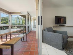 a living room with a couch and a table at Summer Place in Knysna