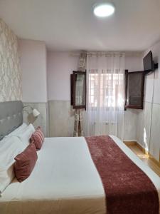 Postel nebo postele na pokoji v ubytování The Vanilla Suite