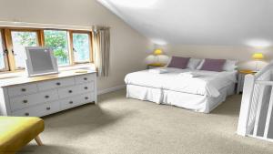 a bedroom with two beds and a dresser with a tv on it at Whitedown in Alton