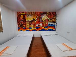 Postel nebo postele na pokoji v ubytování The Bistro House - Loft Unit - Vigan