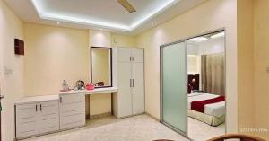 a bathroom with a sink and a bed in a room at Resort Beach View in Cox's Bazar