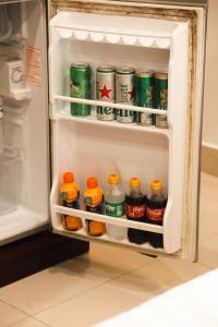 an open refrigerator filled with lots of drinks at MK Two Hotel in My Tho