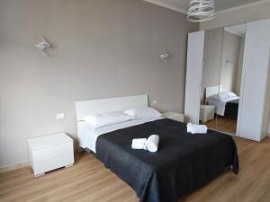 Postel nebo postele na pokoji v ubytování Appartamento Sogni d'Itria