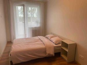 Postel nebo postele na pokoji v ubytování двух комнатная квартира