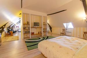 a bedroom with a bed and a living room at Maison charmante avec jardin à Saint-Aulaire, vue sur jardin in Saint-Aulaire