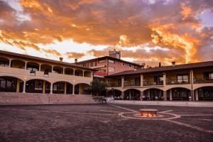 a building with a fire courtyard in front of it at AHG Donna Silvia Wellness Hotel in Manerba del Garda
