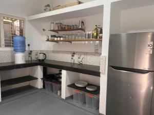 Una cocina o cocineta en The Drop In Madiha I Double Bedroom with private Bathroom