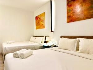 Postel nebo postele na pokoji v ubytování C Y C Heritage Hotel
