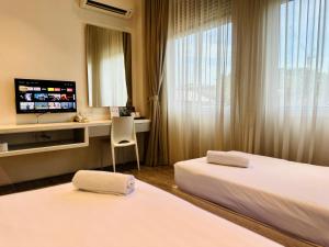 Postel nebo postele na pokoji v ubytování C Y C Heritage Hotel