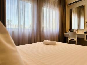 Postel nebo postele na pokoji v ubytování C Y C Heritage Hotel