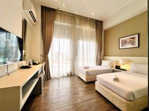 Postel nebo postele na pokoji v ubytování C Y C Heritage Hotel