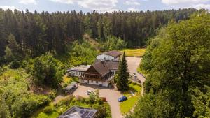 an aerial view of a large house in the woods at Waldhotel Ehrental in Schmalkalden