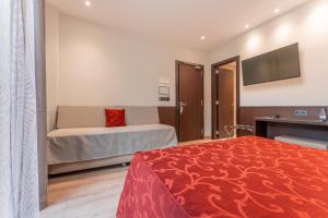 Ein Bett oder Betten in einem Zimmer der Unterkunft Hotel de La Trucha