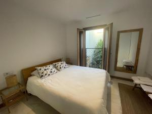 Posteľ alebo postele v izbe v ubytovaní La Casa de la escalera 1 derecha