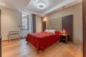 Ein Bett oder Betten in einem Zimmer der Unterkunft Hotel de La Trucha