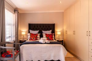 En eller flere senge i et værelse på Tortelduif Cottage