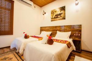 Voodi või voodid majutusasutuse Rustic Villa toas