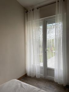 Postel nebo postele na pokoji v ubytování À l ombre des chênes