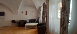 a living room with a couch and a table at Ica House Central in Sibiu