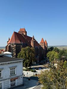 a view of a town with buildings and a street at Apartament Green Powiśle in Kwidzyn