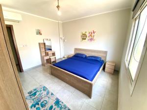Ένα ή περισσότερα κρεβάτια σε δωμάτιο στο Elite Residence KAEC - مدينة الملك عبدالله الاقتصادية