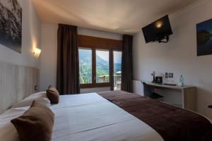 Ein Bett oder Betten in einem Zimmer der Unterkunft Hotel Marco Polo