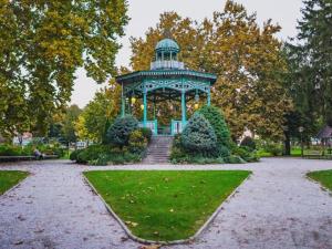 a blue gazebo in the middle of a park at B & B Drava in Koprivnica