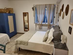 Кровать или кровати в номере La Locanda delle Idee Perugia