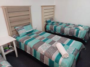 Postel nebo postele na pokoji v ubytování Platinum Loft