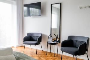 TV/Unterhaltungsangebot in der Unterkunft janu-homes - 3 Zimmer Apartment - 7 Betten, Lahnblick vom Rheinberg