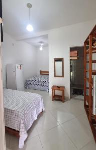 Postel nebo postele na pokoji v ubytování Casa arborizada com 5 suítes