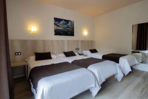 Ein Bett oder Betten in einem Zimmer der Unterkunft Hotel Marco Polo