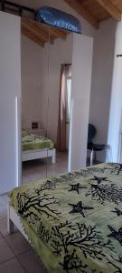 En eller flere senge i et værelse på Casa Adele