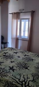 En eller flere senge i et værelse på Casa Adele