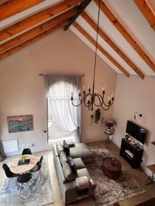 a living room with a couch and a table at Walnut Cottage in Clarens