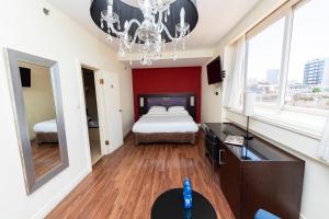 Postel nebo postele na pokoji v ubytování Hotel Basel Tel-Aviv + 15 fotografií